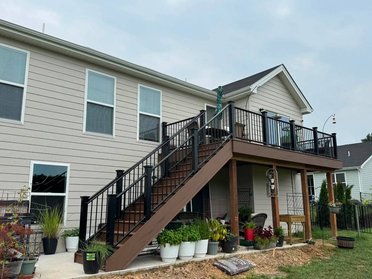 Complete TimberTech Brown Oak composite deck with black railing in Missouri